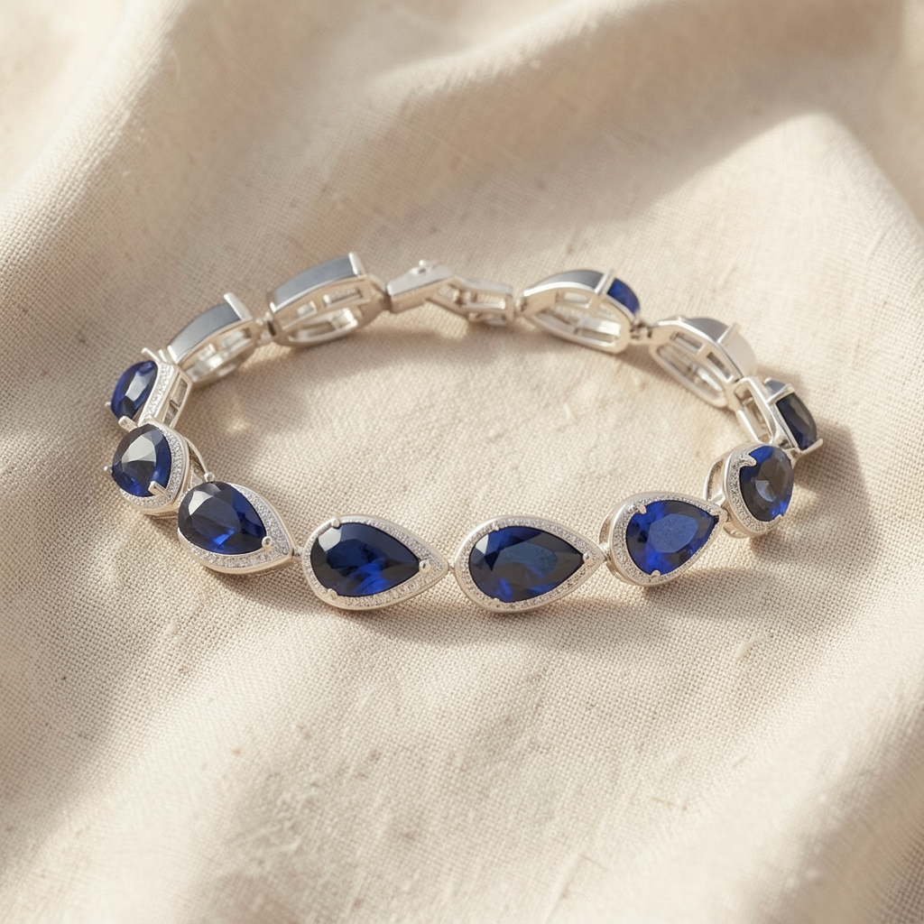Tennisarmband mit Saphirtropfen