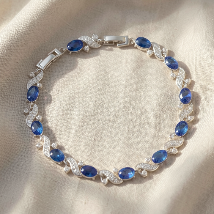 Tennisarmband mit ovalem Saphir und Kristallwirbel