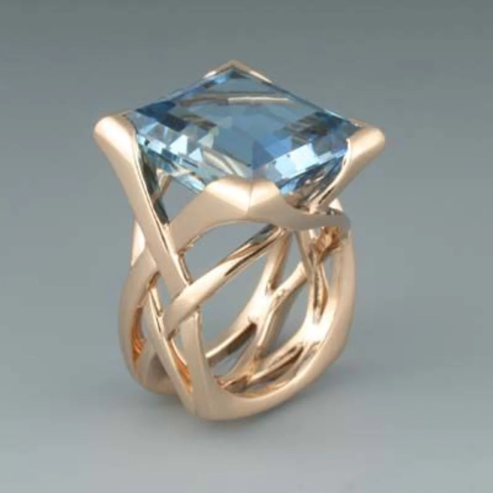 Roségoldener Ring mit blauen Zirkonia