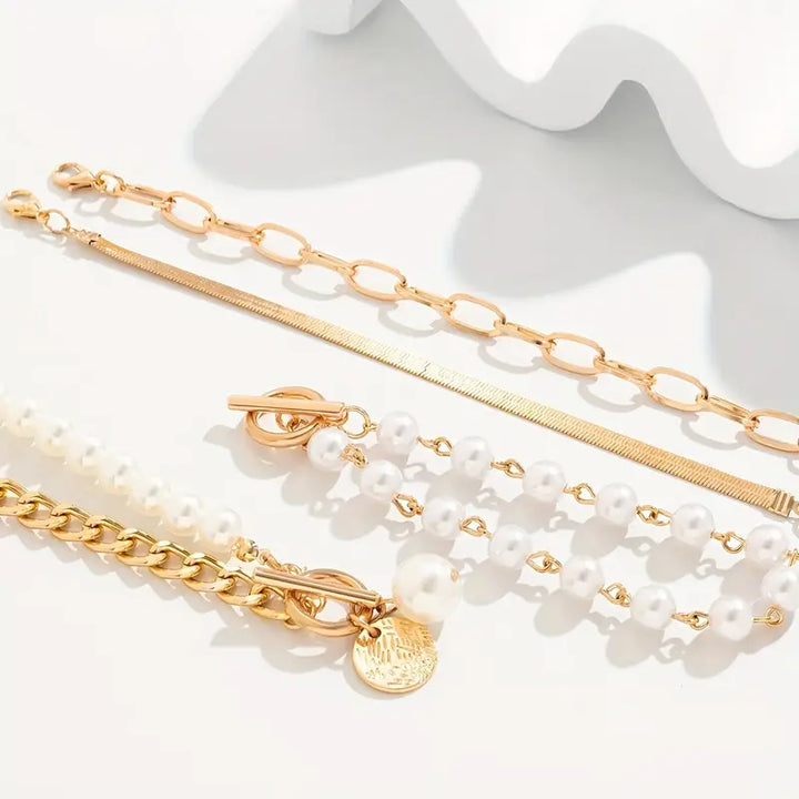 Set mit 4 goldenen Armbändern – Schlangenkette, Perlen und Glieder | Gold