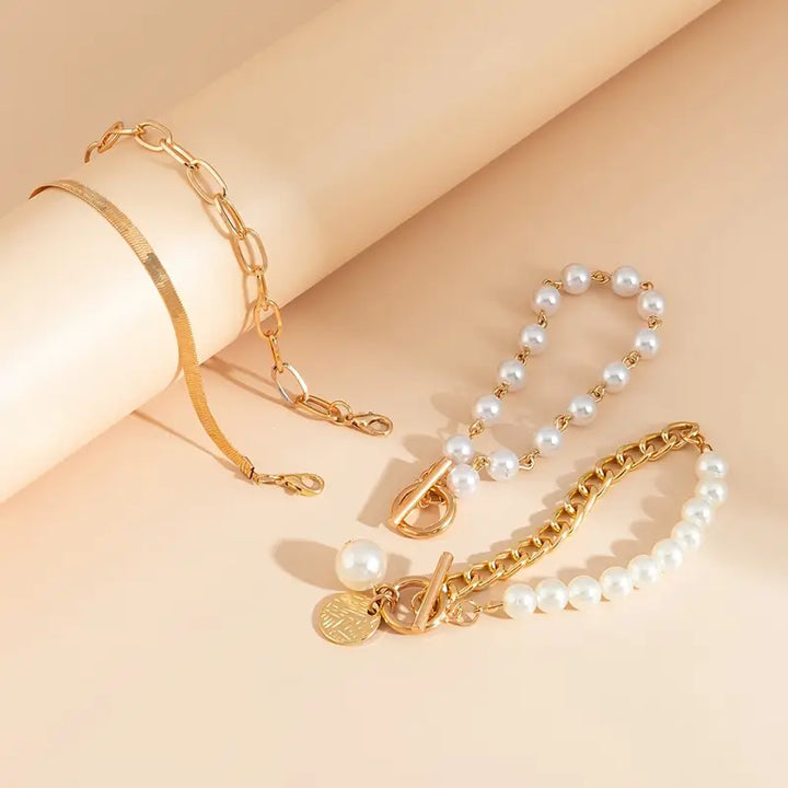 Set mit 4 goldenen Armbändern – Schlangenkette, Perlen und Glieder | Gold