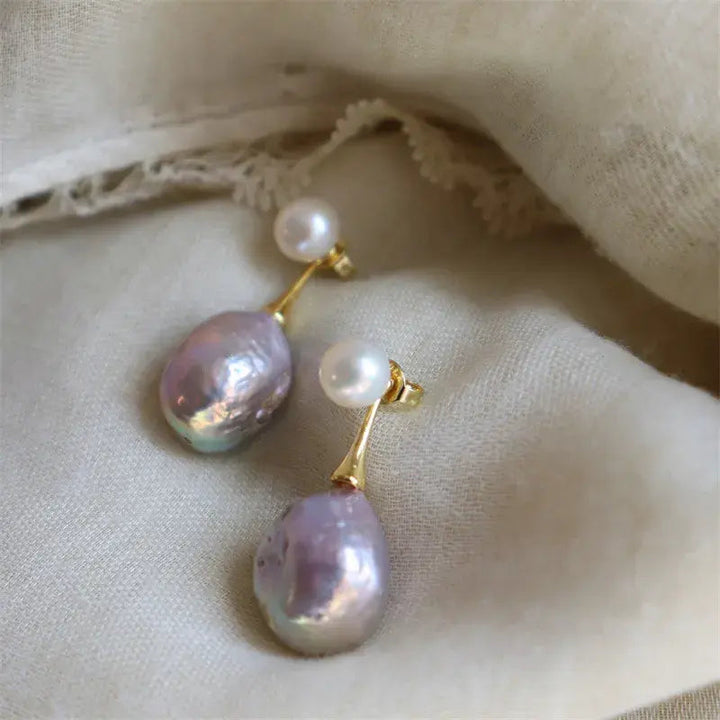 Elegante Ohrringe mit violetter Perle