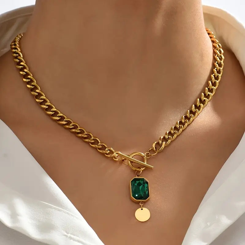 Massive goldene Gliederkette mit Smaragdanhänger