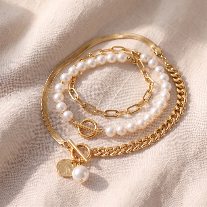 Set mit 4 goldenen Armbändern – Schlangenkette, Perlen und Glieder | Gold